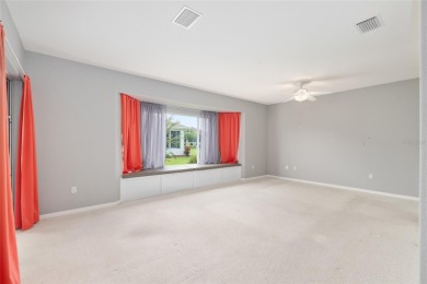 This elegant SANTA ROSA home sits proudly on a corner lot of a on Eagle Ridge At Spruce Creek Country Club in Florida - for sale on GolfHomes.com, golf home, golf lot