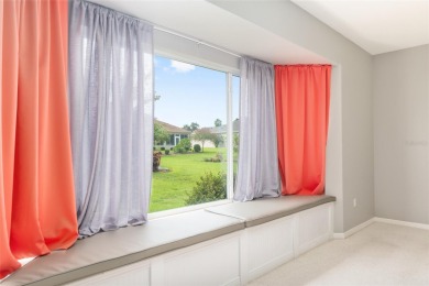 This elegant SANTA ROSA home sits proudly on a corner lot of a on Eagle Ridge At Spruce Creek Country Club in Florida - for sale on GolfHomes.com, golf home, golf lot