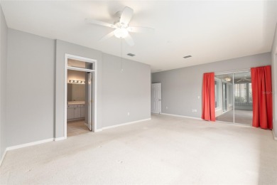 This elegant SANTA ROSA home sits proudly on a corner lot of a on Eagle Ridge At Spruce Creek Country Club in Florida - for sale on GolfHomes.com, golf home, golf lot