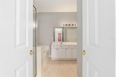 This elegant SANTA ROSA home sits proudly on a corner lot of a on Eagle Ridge At Spruce Creek Country Club in Florida - for sale on GolfHomes.com, golf home, golf lot