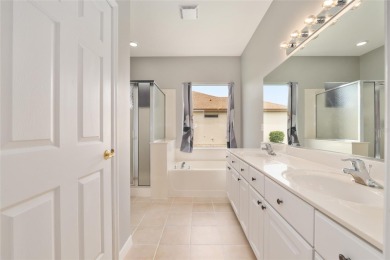 This elegant SANTA ROSA home sits proudly on a corner lot of a on Eagle Ridge At Spruce Creek Country Club in Florida - for sale on GolfHomes.com, golf home, golf lot