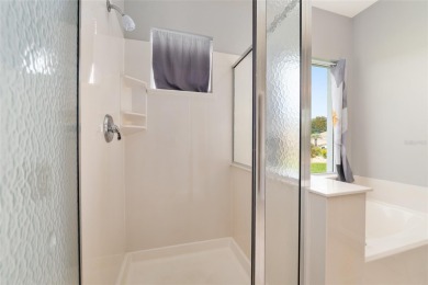 This elegant SANTA ROSA home sits proudly on a corner lot of a on Eagle Ridge At Spruce Creek Country Club in Florida - for sale on GolfHomes.com, golf home, golf lot