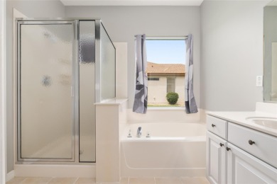 This elegant SANTA ROSA home sits proudly on a corner lot of a on Eagle Ridge At Spruce Creek Country Club in Florida - for sale on GolfHomes.com, golf home, golf lot
