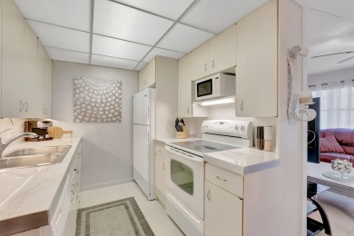 Step into this beautifully furnished 1-bedroom, 1.5-bathroom on Hillsboro Pines Golf in Florida - for sale on GolfHomes.com, golf home, golf lot