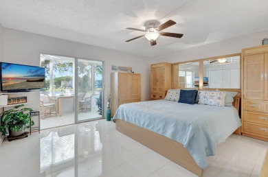 Step into this beautifully furnished 1-bedroom, 1.5-bathroom on Hillsboro Pines Golf in Florida - for sale on GolfHomes.com, golf home, golf lot