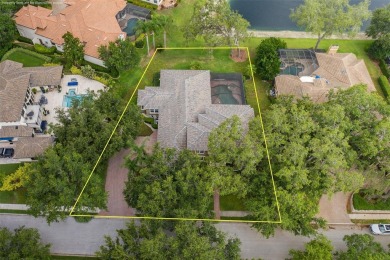 CHAMPIONS CLUB Luxury Bayfair Custom built home tucked behind on Fox Hollow Golf Club in Florida - for sale on GolfHomes.com, golf home, golf lot