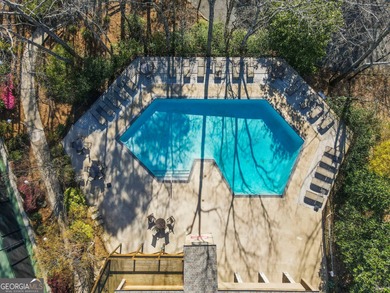 Tucked among mature trees and backing to the Rivermont golf on Rivermont Golf and Country Club in Georgia - for sale on GolfHomes.com, golf home, golf lot