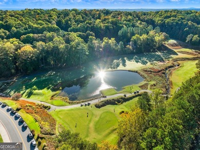 Tucked among mature trees and backing to the Rivermont golf on Rivermont Golf and Country Club in Georgia - for sale on GolfHomes.com, golf home, golf lot