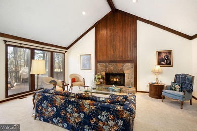 Tucked among mature trees and backing to the Rivermont golf on Rivermont Golf and Country Club in Georgia - for sale on GolfHomes.com, golf home, golf lot