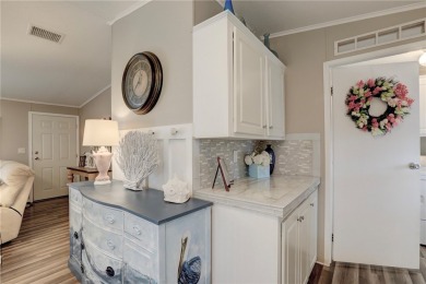 2002 Perimeter lot home. With 3-bed, 2-bath featuring desirable on Barefoot Bay Golf Course in Florida - for sale on GolfHomes.com, golf home, golf lot