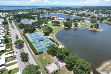 2002 Perimeter lot home. With 3-bed, 2-bath featuring desirable on Barefoot Bay Golf Course in Florida - for sale on GolfHomes.com, golf home, golf lot