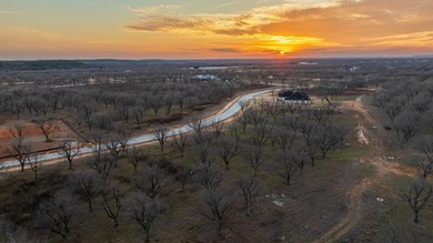 Treed 1.5 acre lot in The Landings East at Pecan Plantation on Pecan Plantation Country Club in Texas - for sale on GolfHomes.com, golf home, golf lot