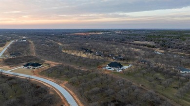 Treed 1.5 acre lot in The Landings East at Pecan Plantation on Pecan Plantation Country Club in Texas - for sale on GolfHomes.com, golf home, golf lot