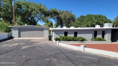 Lovely home located at the first green of Cerbat Cliffs Golf on Cerbat Cliffs Golf Course in Arizona - for sale on GolfHomes.com, golf home, golf lot