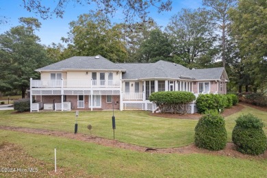 Location, location, location! This stunning, custom home sits on on Lockwood Folly Country Club in North Carolina - for sale on GolfHomes.com, golf home, golf lot