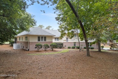 Location, location, location! This stunning, custom home sits on on Lockwood Folly Country Club in North Carolina - for sale on GolfHomes.com, golf home, golf lot