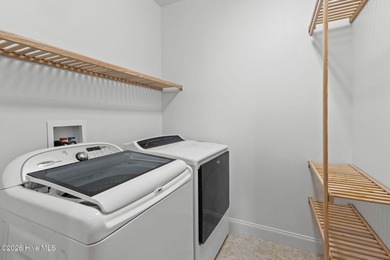 Beautifully built by Trusst, this freshly painted townhome is on Cape Fear National At Brunswick Forest in North Carolina - for sale on GolfHomes.com, golf home, golf lot