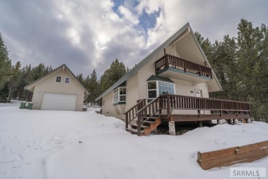 This short term rental sets in the heart of Island Park on Island Park Village Resort Golf Course in Idaho - for sale on GolfHomes.com, golf home, golf lot