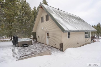 This short term rental sets in the heart of Island Park on Island Park Village Resort Golf Course in Idaho - for sale on GolfHomes.com, golf home, golf lot