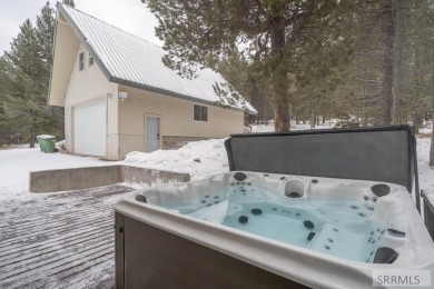 This short term rental sets in the heart of Island Park on Island Park Village Resort Golf Course in Idaho - for sale on GolfHomes.com, golf home, golf lot