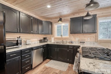 This short term rental sets in the heart of Island Park on Island Park Village Resort Golf Course in Idaho - for sale on GolfHomes.com, golf home, golf lot
