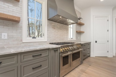 This exquisite new home in the prestigious Richland Pointe on Reynolds Lake Oconee - The Oconee in Georgia - for sale on GolfHomes.com, golf home, golf lot