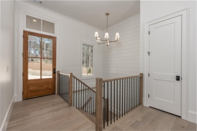 This exquisite new home in the prestigious Richland Pointe on Reynolds Lake Oconee - The Oconee in Georgia - for sale on GolfHomes.com, golf home, golf lot