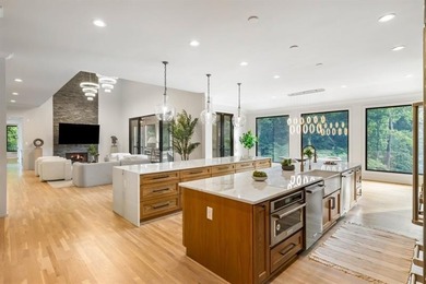 Set at the quiet end of an exclusive cul-de-sac, beyond a secure on Bobby Jones Golf Club in Georgia - for sale on GolfHomes.com, golf home, golf lot