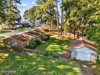 This spacious 3 bedroom 2 bath home showcases beautiful hardwood on Bayview Golf Course in North Carolina - for sale on GolfHomes.com, golf home, golf lot