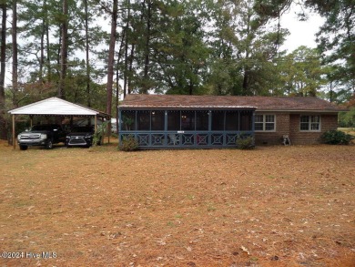 This spacious 3 bedroom 2 bath home showcases beautiful hardwood on Bayview Golf Course in North Carolina - for sale on GolfHomes.com, golf home, golf lot