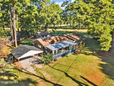 This spacious 3 bedroom 2 bath home showcases beautiful hardwood on Bayview Golf Course in North Carolina - for sale on GolfHomes.com, golf home, golf lot