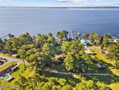 This spacious 3 bedroom 2 bath home showcases beautiful hardwood on Bayview Golf Course in North Carolina - for sale on GolfHomes.com, golf home, golf lot