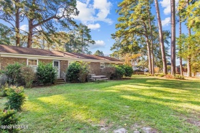 This spacious 3 bedroom 2 bath home showcases beautiful hardwood on Bayview Golf Course in North Carolina - for sale on GolfHomes.com, golf home, golf lot