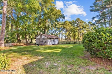 This spacious 3 bedroom 2 bath home showcases beautiful hardwood on Bayview Golf Course in North Carolina - for sale on GolfHomes.com, golf home, golf lot