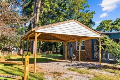 This spacious 3 bedroom 2 bath home showcases beautiful hardwood on Bayview Golf Course in North Carolina - for sale on GolfHomes.com, golf home, golf lot