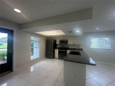 This 55 and over  2 bedroom 2 bath 1129 sq ft condo is located on Beacon Woods Golf Club in Florida - for sale on GolfHomes.com, golf home, golf lot