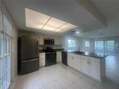 This 55 and over  2 bedroom 2 bath 1129 sq ft condo is located on Beacon Woods Golf Club in Florida - for sale on GolfHomes.com, golf home, golf lot