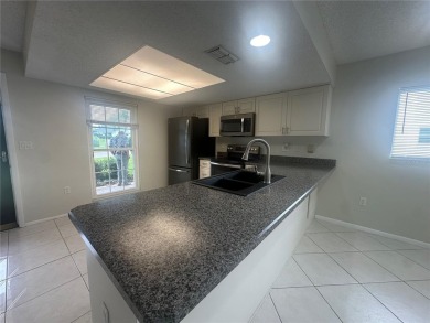 This 55 and over  2 bedroom 2 bath 1129 sq ft condo is located on Beacon Woods Golf Club in Florida - for sale on GolfHomes.com, golf home, golf lot