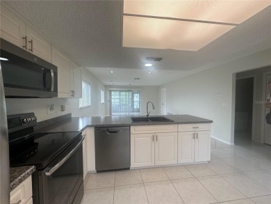 This 55 and over  2 bedroom 2 bath 1129 sq ft condo is located on Beacon Woods Golf Club in Florida - for sale on GolfHomes.com, golf home, golf lot