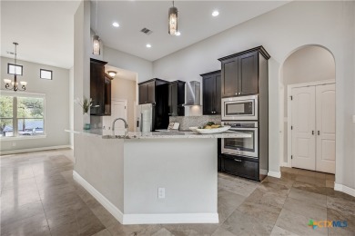 Enter this oasis where the custom solid steel front door opens on Lago Vista Golf Club in Texas - for sale on GolfHomes.com, golf home, golf lot