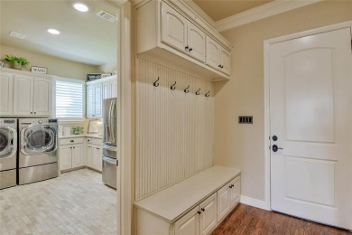 Spectacular custom home nestled on a quiet cul-de-sac with on Pecan Plantation Country Club in Texas - for sale on GolfHomes.com, golf home, golf lot