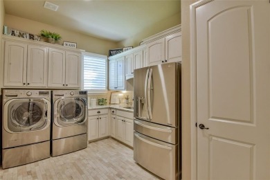 Spectacular custom home nestled on a quiet cul-de-sac with on Pecan Plantation Country Club in Texas - for sale on GolfHomes.com, golf home, golf lot