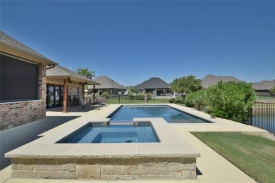 Spectacular custom home nestled on a quiet cul-de-sac with on Pecan Plantation Country Club in Texas - for sale on GolfHomes.com, golf home, golf lot