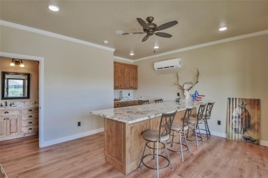 Spectacular custom home nestled on a quiet cul-de-sac with on Pecan Plantation Country Club in Texas - for sale on GolfHomes.com, golf home, golf lot