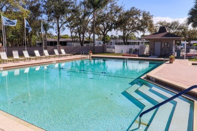 Large triple wide manufactured home located in Tall Oaks, a 55 on TPC At Treviso Bay in Florida - for sale on GolfHomes.com, golf home, golf lot