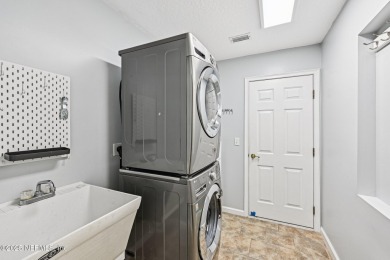 Welcome to this beautifully updated 4-bedroom, 3-bathroom pool on Jacksonville Golf and Country Club in Florida - for sale on GolfHomes.com, golf home, golf lot