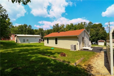 Lake views and peace surround this adorable home. Step into your on Indian Rock Golf Club in Missouri - for sale on GolfHomes.com, golf home, golf lot