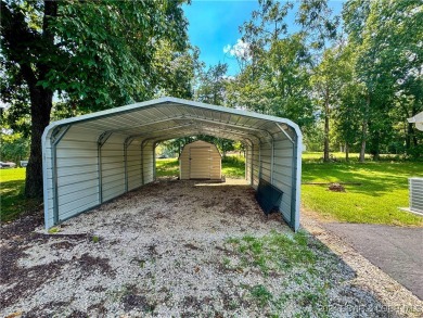 Lake views and peace surround this adorable home. Step into your on Indian Rock Golf Club in Missouri - for sale on GolfHomes.com, golf home, golf lot