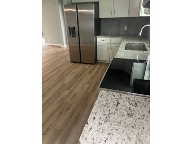 Don't miss your chance to own this beautifully renovated home in on Hamptons Golf Club in Florida - for sale on GolfHomes.com, golf home, golf lot