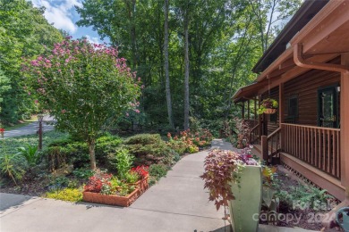 NO DAMAGE FROM HELENE-HIGH  DRY. This warm and inviting log home on Waynesville Country Club Inn in North Carolina - for sale on GolfHomes.com, golf home, golf lot